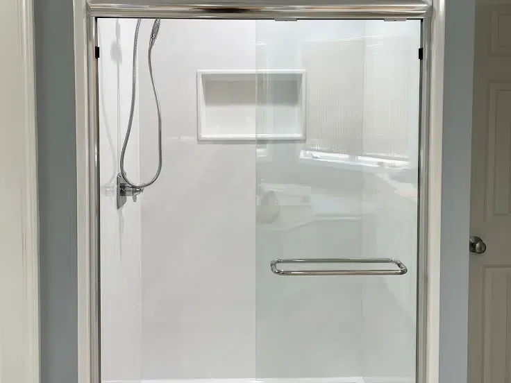 Remodeled walk-in shower with frameless glass