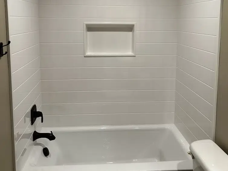 Tub and shower combo with matte black fixtures